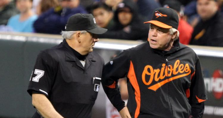 Umpire Larry Vanover (27) and Baltimore Orioles manager Buck Showalter (26)